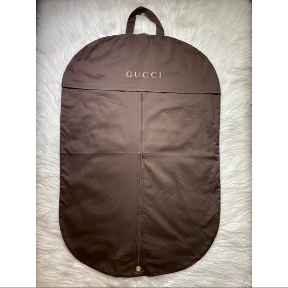 Brown Gucci hanging storage cover